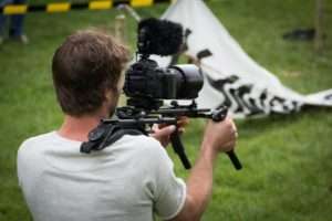 Man using video camera